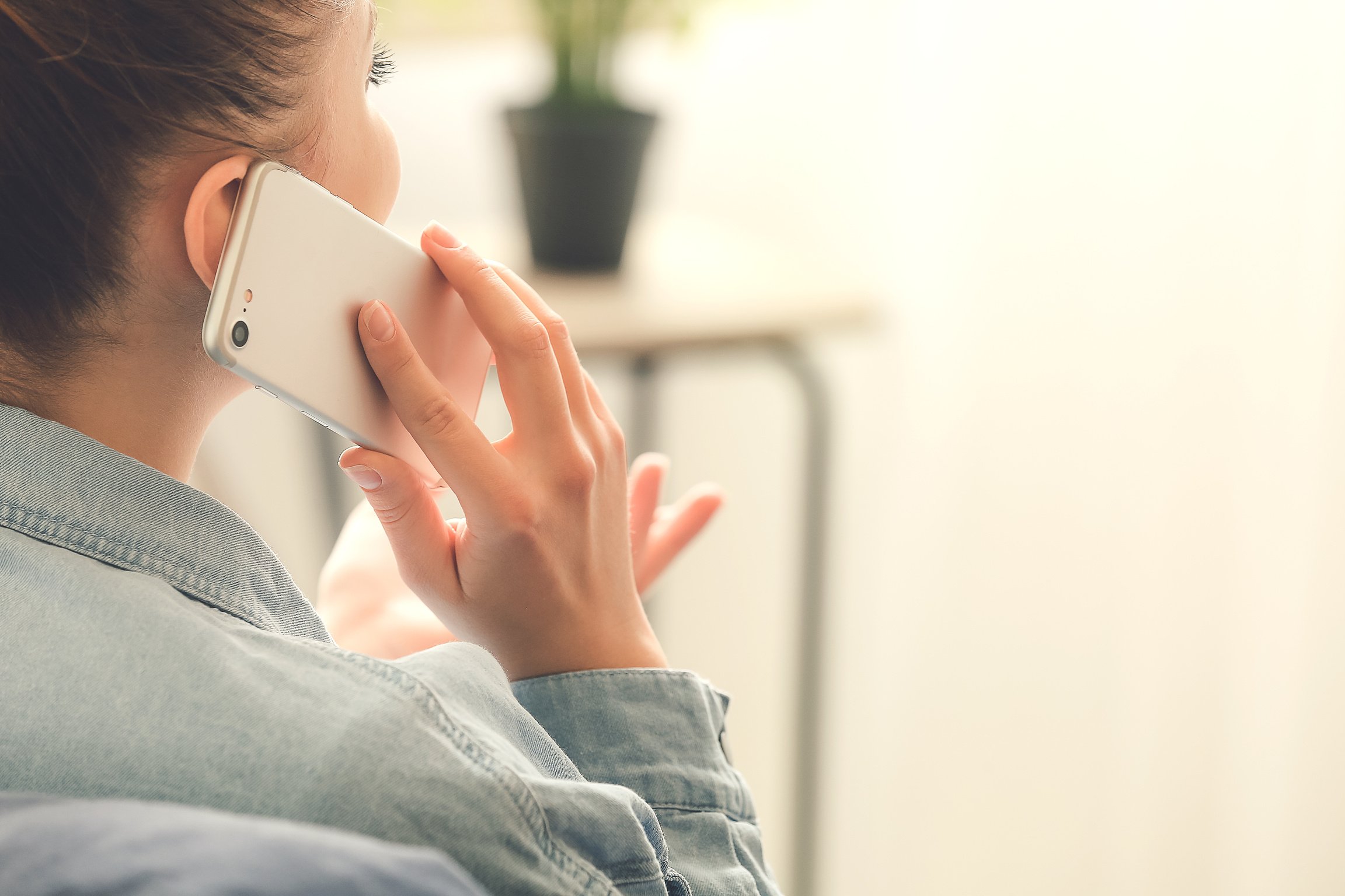 Woman Talking on the Phone at Home